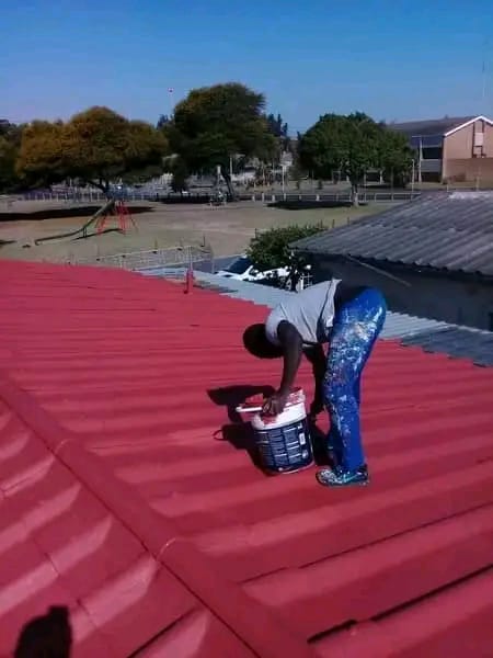 Roof tiles being cut in by brush